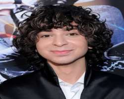 His curly hair is his trademark.